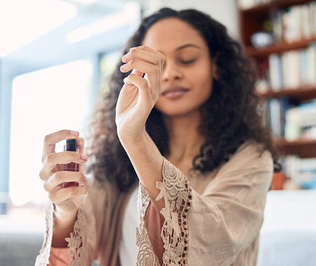 How to test perfumes: A woman testing perfume on her hands